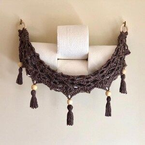 Crochet hammock pattern works as a crochet wall hanging, crochet fruit holder, or crochet home decor organizer. The lacy crochet stitch design makes this pattern both fashionable and functional.
