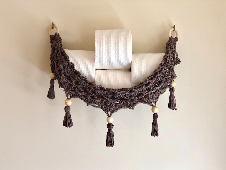 Crochet hammock pattern works as a crochet wall hanging, crochet fruit holder, or crochet home decor organizer. The lacy crochet stitch design makes this pattern both fashionable and functional.