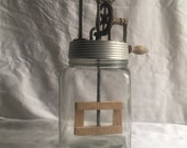 Vintage antique mechanical butter churn. Clockwork handle. Eco-kitchen. Rustic kitchen decor.
