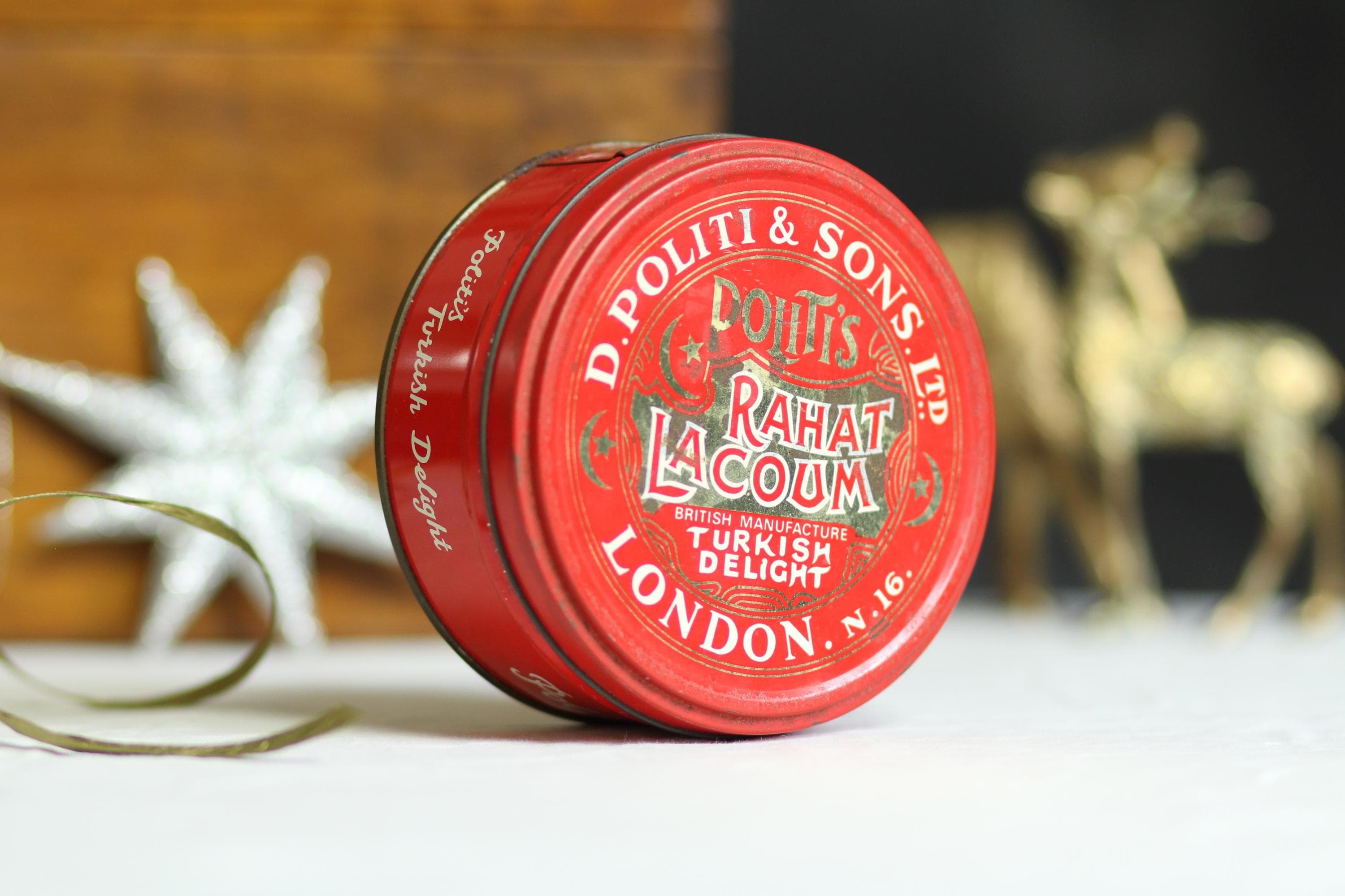 Vintage Turkish Delight storage tin. D. Politti & Sons. Red. Sweet tin. Metal container. Aged. Festive. Christmas. Circa mid 20th century.