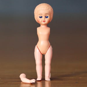 Vintage celluloid miniature doll. 1950s. Parts only. Closing eyes. Celluloid plastic body. Moveable limbs. Made in Italy. Circa 1950s.