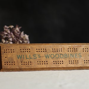 Vintage wooden score board. Cigarette advertising. Card game marker. Curio. Tobacciana. Man cave decor. Circa early - mid 20th century.