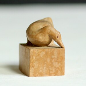 Vintage miniature carved wooden duck. Hand-crafted model. Bird statue. Wildlife figurine. Circa mid-late 20th century.