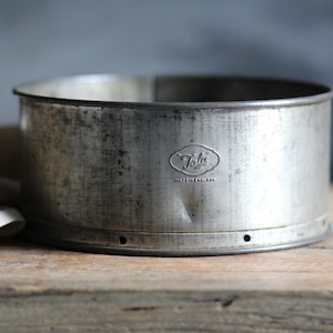 Vintage ‘Tala’ cake tin. Aged. Circular. Mid-century. Removable base. Metal. Victoria sponge tin. Patinated. Kitchen display. Circa 1960s.