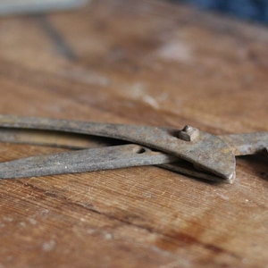Vintage cast metal spanner. Tool chest. Industrial. Functional. Woodwork. Metal. Desk ornament. Study. Rusted. Aged. Circa 1950s.