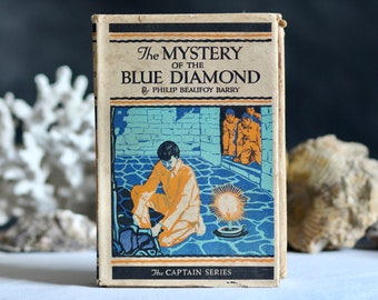 Antiquität „Das Geheimnis des blauen Diamanten“ von Philip Beaufoy Barry. Gebundene Ausgabe. Abenteuerroman für Kinder. Art-Deco-Einband. Etwa 1920er Jahre.