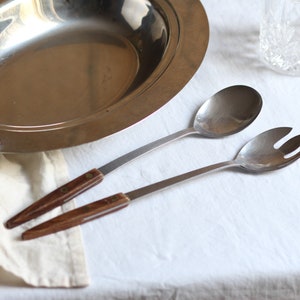 Mid-century salad tongs. Modernist. Wooden handles. Metal. Vintage. Atomic design. Serving forks. Circa 1960s.