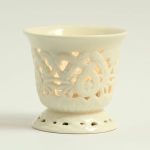 Vintage porcelain tealight holder. Bright white. Filigree. Cut out. Candle. Regal. Circa late 20th century.
