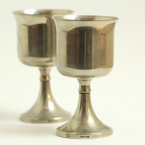 Pair of vintage silver-plated goblets. Wine glasses. Moulded metal. Silver drink ware. Cocktail bar. Set of two. Circa early 20th century.