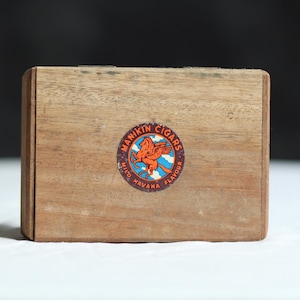 Vintage wooden box. Hinged lid. Empty box. Manikin. Tobacciana. Lettered. Typography. Aged wood. Small storage. Circa late 20th century.