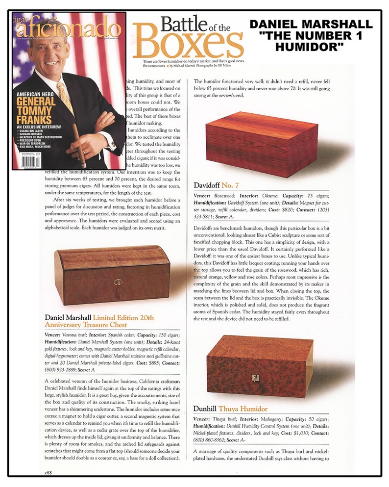 May include: A close-up of a wooden humidor with a dark brown finish. The humidor is labelled "Daniel Marshall" and "The Number 1 Humidor".