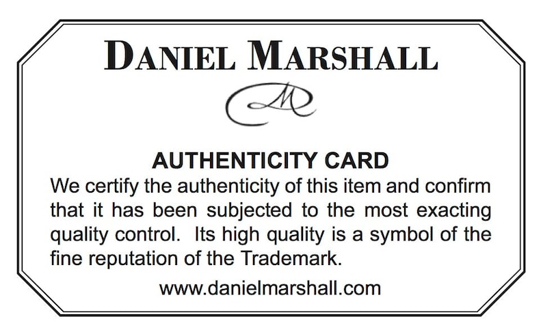 May include: A black and white authenticity card with the text "DANIEL MARSHALL" and "AUTHENTICITY CARD". The card also includes the text "We certify the authenticity of this item and confirm that it has been subjected to the most exacting quality control. Its high quality is a symbol of the fine reputation of the Trademark." and "www.danielmarshall.com".