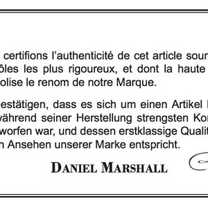 May include: A black and white image of a certificate of authenticity. The text reads "Nous certifions l'authenticit&eacute; de cet article soumis aux contr&ocirc;les les plus rigoureux, et dont la haute qualit&eacute; symbolise le renom de notre Marque. Wir best&auml;tigen, dass es sich um einen Artikel handelt der w&auml;hrend seiner Herstellung strengsten Kontrollen unterworfen war, und dessen erstklassige Qualit&auml;t dem hohen Ansehen unserer Marke entspricht." The text is signed "DANIEL MARSHALL".