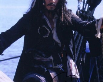 Johnny Depp Signed "Pirates of the Caribbean" 11x14 Photo (PSA Hologram)