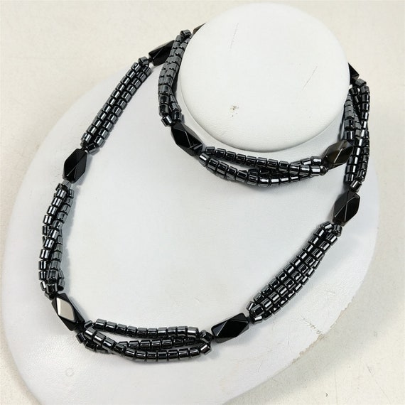 shell bead necklace with black and gold sahri thread Intertwined hematite