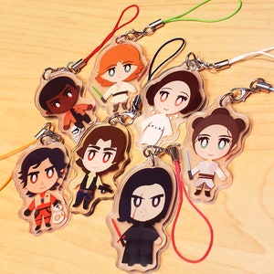 May include: Set of ten colorful character charms with lanyards. The charms are made of clear plastic with cartoon characters inside. The characters are from the Star Wars franchise.
