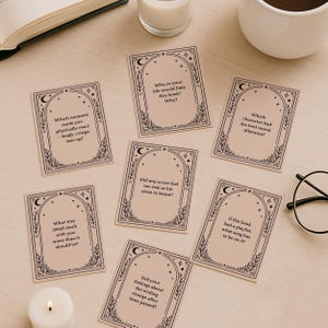 Printable book discussion cards in black and beige with mystical, tarot-inspired design. Perfect for dark academia reading groups, cottagecore book clubs, or anyone looking for structured book club activity ideas. Includes editable book club questions and readymade discussion-starters. Great gift for a book lover friend. Works well as a book club game, icebreaker, or reading group tool.