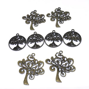 May include: A collection of bronze-colored tree charms with intricate, openwork designs. The charms feature detailed tree silhouettes, some within circular frames, and are suitable for jewelry making or craft projects.