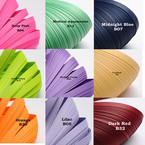 May include: Nine different colors of paper strips, each rolled into a spiral shape. The colors are deep pink, medium aquamarine, midnight blue, green yellow, medium purple, peach puff, orange, lilac, and dark red. Each color has a corresponding code, such as B04, B12, B07, B15, B06, B22, B20, B05, and B32.
