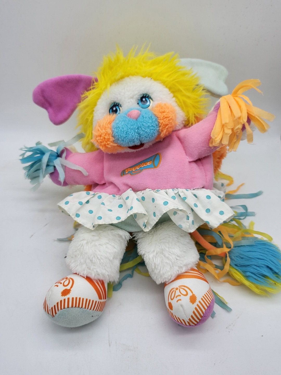 The image shows a vintage Puffball Popple plush toy