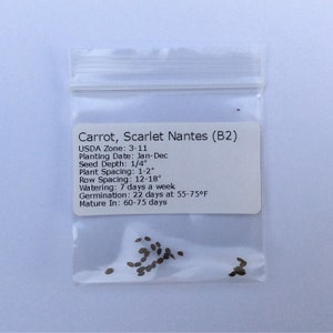 May include: A small plastic bag containing a packet of carrot seeds labeled "Carrot, Scarlet Nantes (B2)". The packet includes planting information, such as USDA zone, planting date, seed depth, plant spacing, row spacing, watering, germination, and mature time.