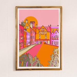May include: A digital illustration of a colorful cityscape with pink, orange, and yellow buildings. The buildings are lined up along a canal with a bridge over it. The sky is a light pink color with a yellow sun.