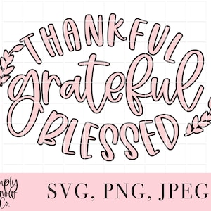 May include: Black and pink graphic design with the text "Thankful Grateful Blessed" and two small leaf designs on either side.