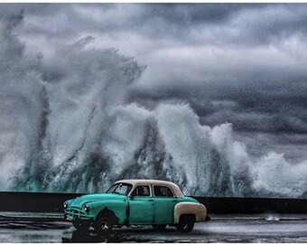 Photo of teal vintage car on El Malecón, Havana, Cuba, by Pulitzer Prize-winning photographer