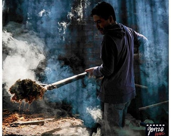 Photo of a palenquero working on producing mezcal in Santo Catarina Minas, Oaxaca, by Pulitzer Prize-winning photographer