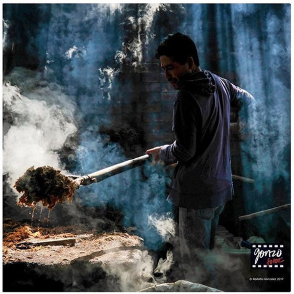 Photo of a palenquero working on producing mezcal in Santo Catarina Minas, Oaxaca, by Pulitzer Prize-winning photographer