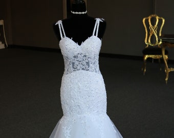 Bridal mermaid wedding gown. See through bodice sequin