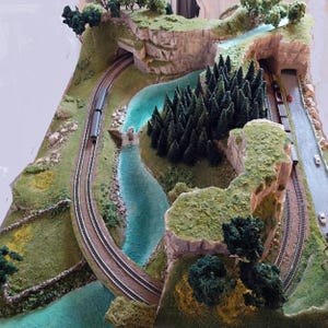 Scenic landscape double track model railway layout on a base of 120 x 90 cms