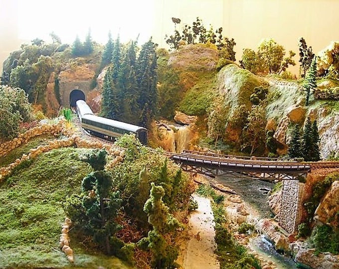 Double track model railway layout with watarfall and lake in N scale 1/160