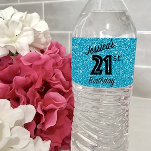 May include: A blue glitter water bottle label with the text "Jessica's 21st Birthday".