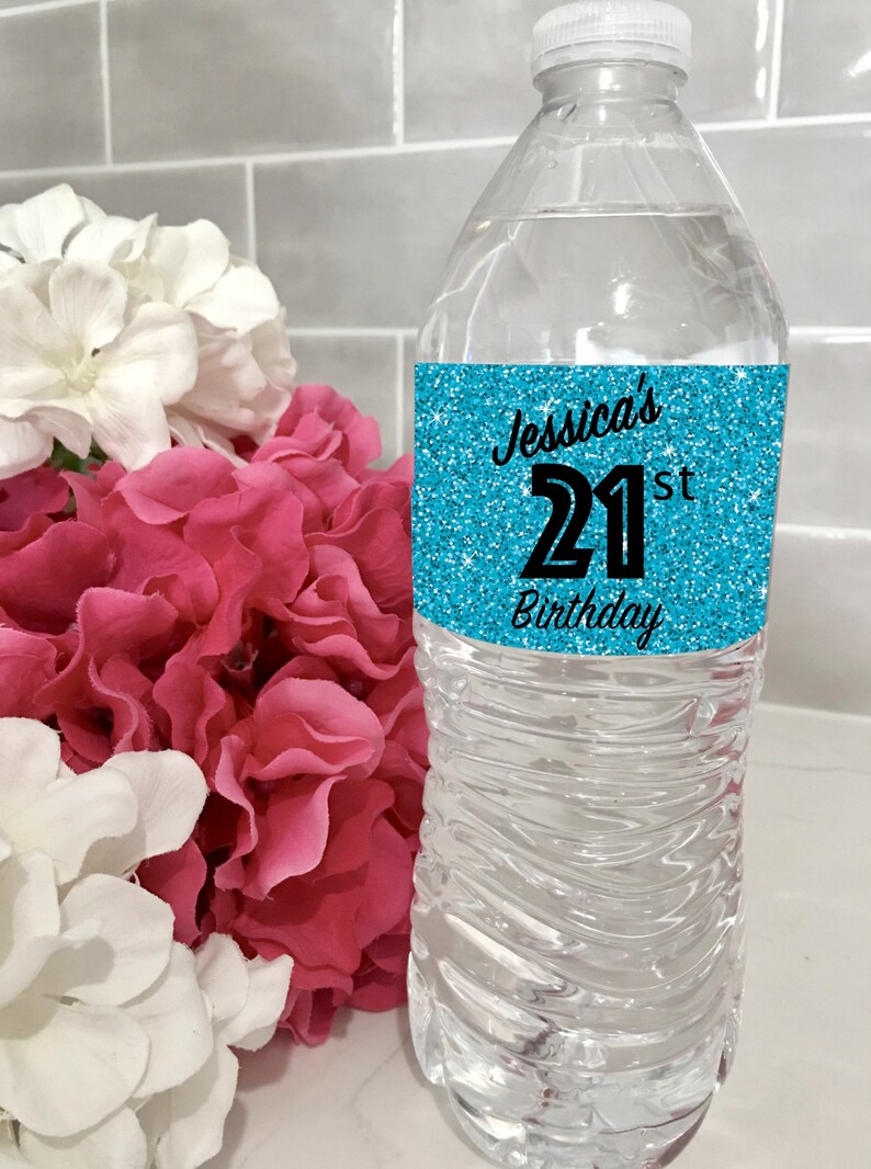 May include: A blue glitter water bottle label with the text "Jessica's 21st Birthday".