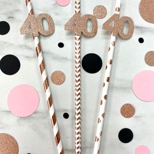 May include: Three gold glitter straws with the number "40" on each straw. The straws have different patterns: stripes, zigzags, and polka dots.