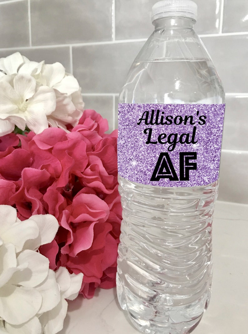 May include: A clear plastic water bottle with a purple glitter label that says "Allison's Legal AF".