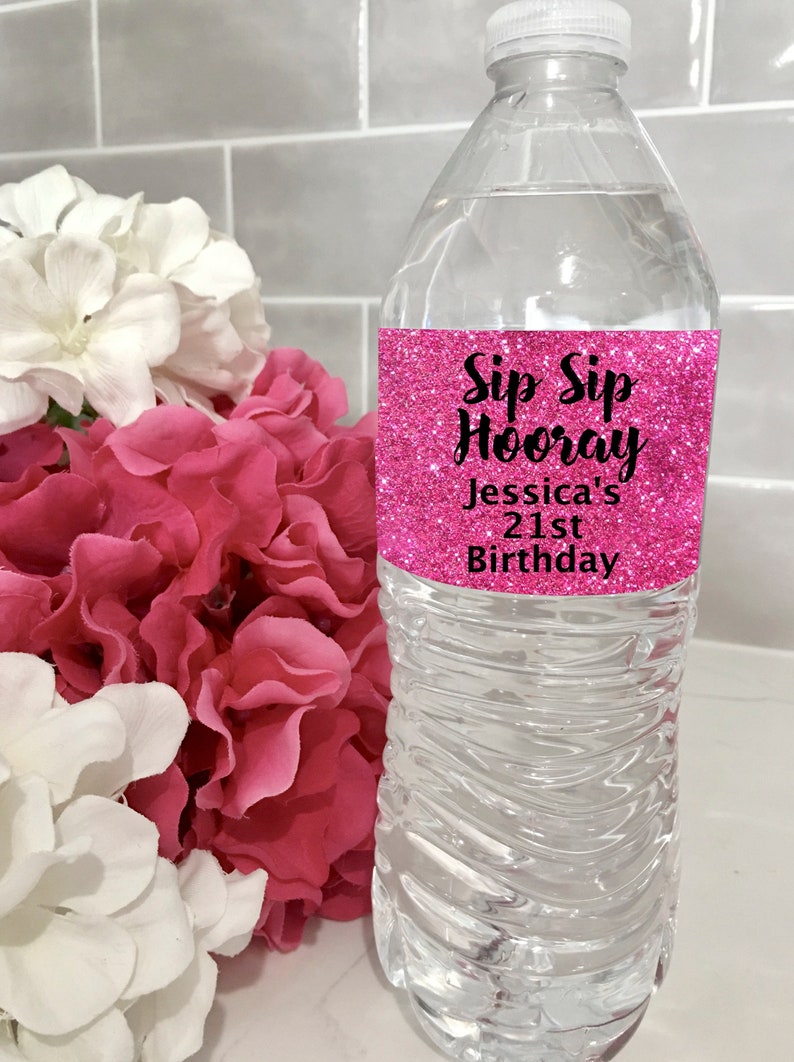 May include: Pink glitter water bottle label with the text "Sip Sip Hooray Jessica's 21st Birthday".