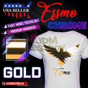 May include: A white t-shirt with a gold chrome eagle design and the text "Essmo" in gold chrome lettering. The text "JDM" is visible in the background. The text "USA SELLER", "FAST WEED TECHOLOGY", "PREMIUM ADHESIVE", "CHROME", and "AUTHORIZED RESELLER" are also visible in the image.