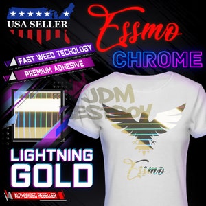 May include: A white t-shirt with a gold and iridescent eagle design on the front. The design includes the text "JDM EST. 2014" and "Essmo". The shirt also has the text "Essmo CHROME" and "LIGHTNING GOLD" on the front.