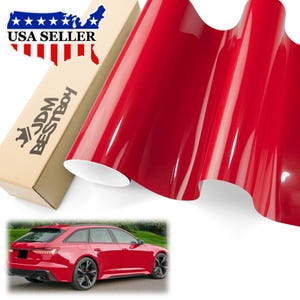 May include: A roll of glossy red vinyl wrap material with a white backing. A cardboard box with the text "JDM BESTBOY" and "USA SELLER" is visible. A red car is shown in the bottom of the image.