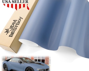 May include: A roll of matte blue vinyl wrap with a car wrapped in the same vinyl. The vinyl wrap is a popular choice for car enthusiasts looking to customize their vehicles.