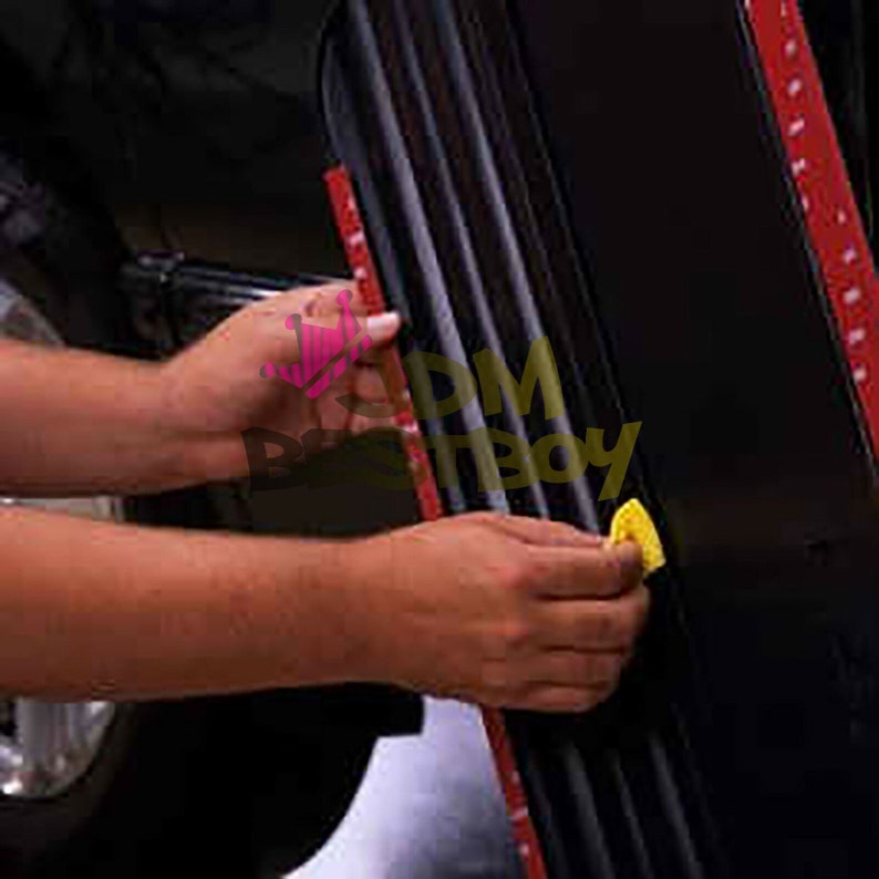 May include: A person is applying a black car door edge guard with red adhesive tape. The guard has vertical ridges and is being installed on a black car door. A yellow applicator is used.