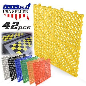 May include: A set of 42 interlocking floor tiles in various colors, including yellow, gray, black, blue, green, and orange. The tiles are made of a durable, flexible material and are designed to be easy to install and clean. They are perfect for use in garages, workshops, and other areas where a durable and easy-to-clean floor is needed.