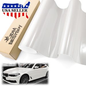 May include: A roll of glossy white vinyl wrap material is displayed next to a cardboard box with the text "JDM BESTBOY" and a USA Seller graphic. A white car is shown in the bottom of the image.