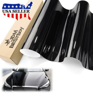 May include: A roll of black gloss vinyl wrap with a car hood wrapped in the same vinyl. The roll is on a cardboard tube with the text "JDM BESTBOY" and "USA SELLER" printed on the tube.