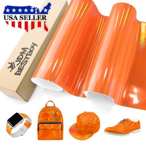 May include: Orange vinyl wrap with a holographic finish. The wrap is shown rolled up and is available in a variety of sizes. The image also shows a backpack, a hat, and a shoe, all made with the same vinyl wrap.