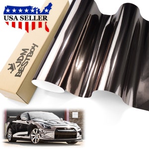 May include: A roll of black chrome vinyl wrap with a car wrapped in the same vinyl. The vinyl has a mirror-like finish. The text "JDM BESTBOY" is on the box.