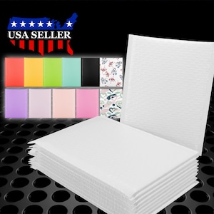May include: A stack of white padded mailing envelopes. The envelopes are made of a durable material and have a bubble-like texture. The envelopes are perfect for shipping small items.