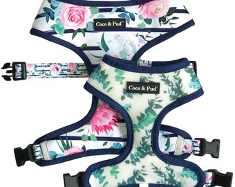 May include: Two floral dog harnesses with adjustable straps and navy blue trim. The harnesses feature a white background with a floral pattern and the text "Coco & Pud".